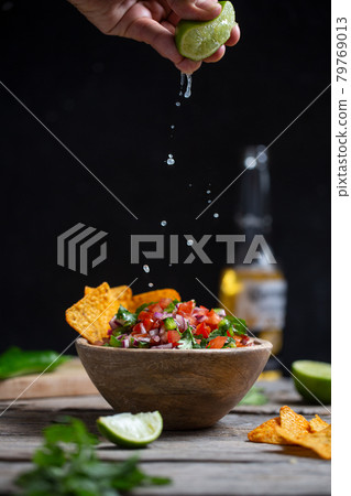 Man Homemade salsa pico de gallo, mexican cuisine 79769013