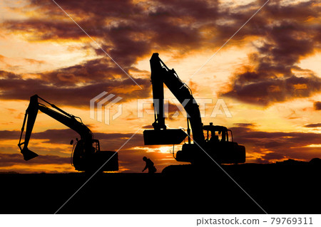 Silhouette of sunset and excavator 79769311