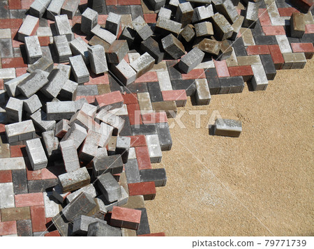 Precast concrete pavers stone like material used as finishes for vehicle road and pedestrian walkway.  79771739