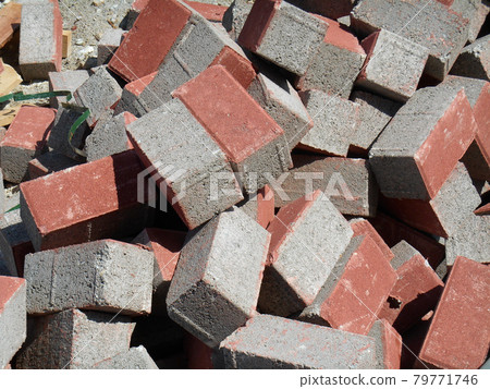Precast concrete pavers stone like material used as finishes for vehicle road and pedestrian walkway.  79771746