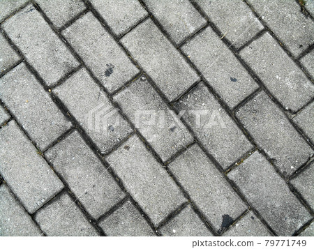 Precast concrete pavers stone like material used as finishes for vehicle road and pedestrian walkway.  79771749