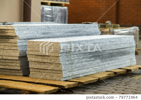 Piles of granite marble slabs. Stone sheets for decorative construction. Piles of granite marble slabs. Stone sheets for decorative construction. 79771964