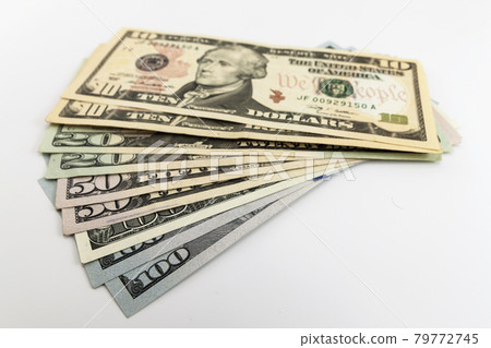 US american dollar money bills spread on white background US american dollar money bills spread on white background 79772745
