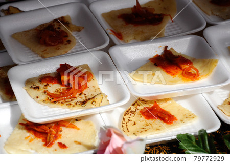 Traditional Malaysian pencake local called lempeng. Eat together with fried chili sauce called sambal.  79772929