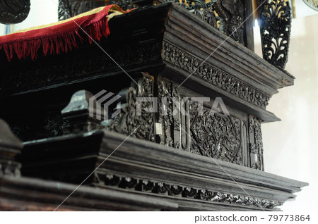 JOGJAKARTA, INDONESIA -JUNE 12, 2014: Wooden mimbar design and detail at old Mosque of Masjid Besar Mataram Kotagede. It was used by Imam to give speech in the mosque. JOGJAKARTA, INDONESIA -JUNE 12, 2014: Wooden mimbar design and detail at old Mosque of Masjid Besar Mataram Kotagede. It was used by Imam to give speech in the mosque. 79773864