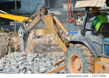JOHOR, MALAYSIA -JUNE 26, 2016: Concrete hacking machine used to crush waste concrete to small pieces at the construction site in Malaysia. 79773994