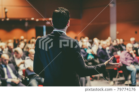 Speaker giving a talk at business conference meeting. Speaker giving a talk at business conference meeting. 79774176