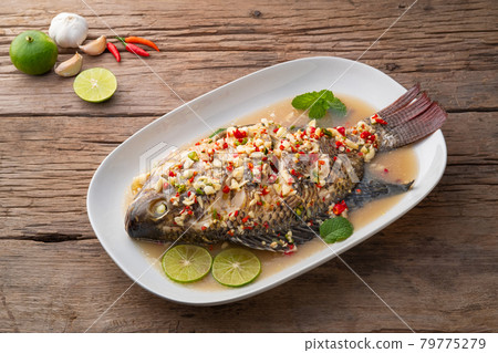 Steamed Tilapia Fish In Spicy Lime Soup Steamed Tilapia Fish In Spicy Lime Soup 79775279