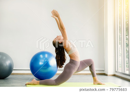 Caucasian woman exercise doing the yoga pose stretching at home, healthy lifestyle concept Caucasian woman exercise doing the yoga pose stretching at home, healthy lifestyle concept 79775683