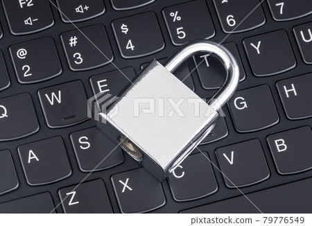 Computer security concept. Silver padlock on black laptop keyboard 79776549