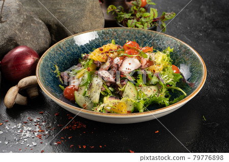 Salad with octopus and fresh vegetables 79776898