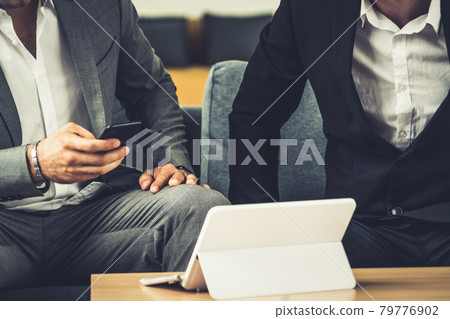 Businessmen are in business meeting in office. Businessmen are in business meeting in office. 79776902