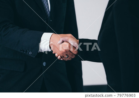 Business people handshake agreement in office. Business people handshake agreement in office. 79776903