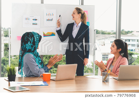 Multicultural working group in teamwork meeting. Multicultural working group in teamwork meeting. 79776908