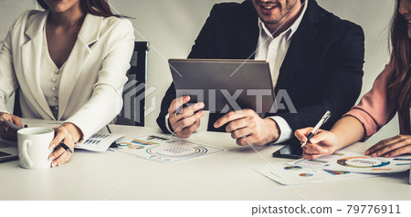 Businessman and businesswomen working in office. Businessman and businesswomen working in office. 79776911