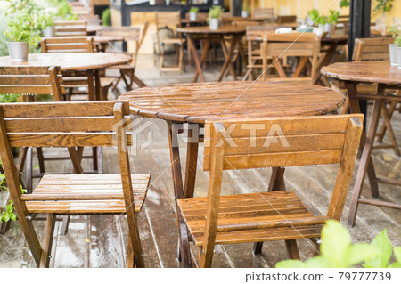 Empty tables on the terrace in a cafe after the rain 79777739