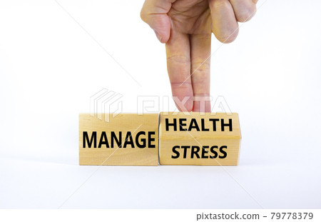 Manage stress and be health symbol. Doctor turns a cube and changes words 'manage stress' to 'manage health'. Beautiful white background. Psychological, business and manage stress concept. Copy space. Manage stress and be health symbol. Doctor turns a cube and changes words 'manage stress' to 'manage health'. Beautiful white background. Psychological, business and manage stress concept. Copy space. 79778379