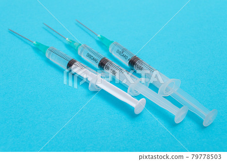 Several Syringe on Blue Table 79778503