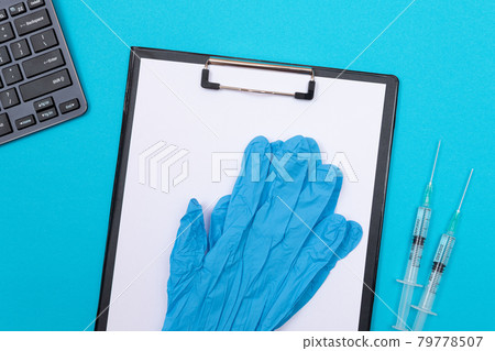 Vaccination or Revaccination Concept - Two Medical Syringe on Blue Table 79778507