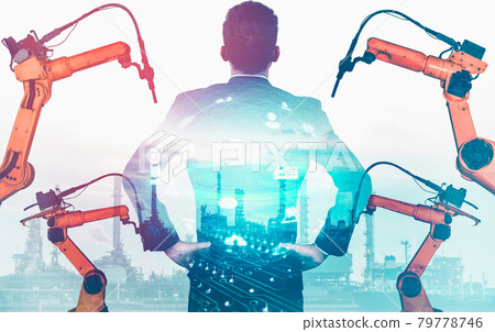Mechanized industry robot arm and factory worker double exposure Mechanized industry robot arm and factory worker double exposure 79778746