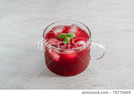 Healthy fruit juice with ice and apple mint Healthy fruit juice with ice and apple mint 79779409