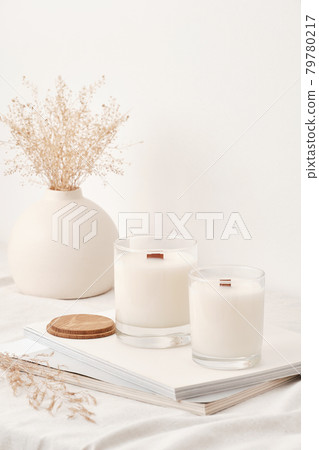 Handmade scented candles in a glass with a wooden lid. Soy wax candles with a wooden wick. 79780217