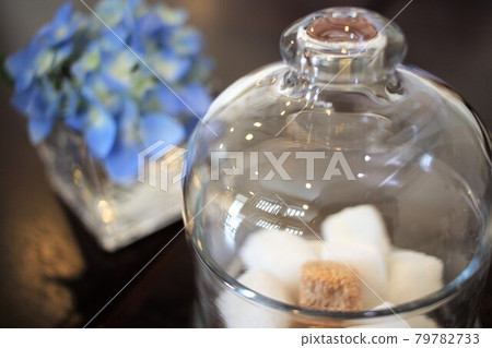 Glass sugar pot and flowers 79782733