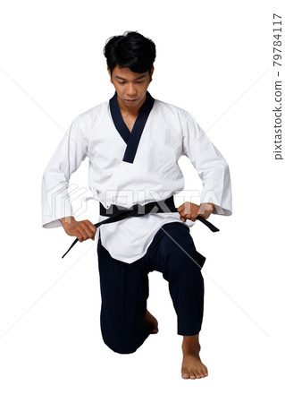 Sport Master of TaeKwonDo practice Karate Poses, isolated full length Sport Master of TaeKwonDo practice Karate Poses, isolated full length 79784117