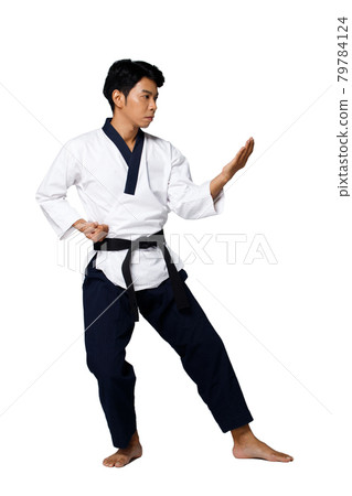 Sport Master of TaeKwonDo practice Karate Poses, isolated full length Sport Master of TaeKwonDo practice Karate Poses, isolated full length 79784124