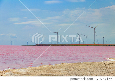 Wind turbines on a shore of the pink salty Syvash lake in Kherson region, Ukraine. Renewable energy Wind turbines on a shore of the pink salty Syvash lake in Kherson region, Ukraine. Renewable energy 79787166