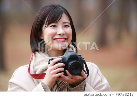 A woman taking a picture A woman taking a picture 79788212