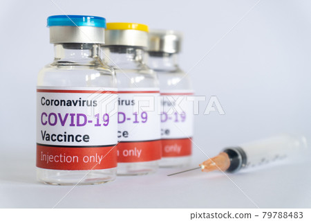 Bottles of vaccine COVID-19 virus with syringe on white background Bottles of vaccine COVID-19 virus with syringe on white background 79788483