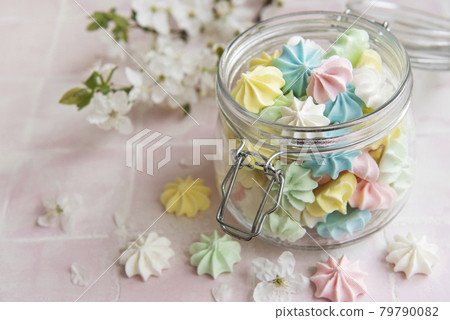 Small colorful meringues in the glass jar Small colorful meringues in the glass jar 79790082