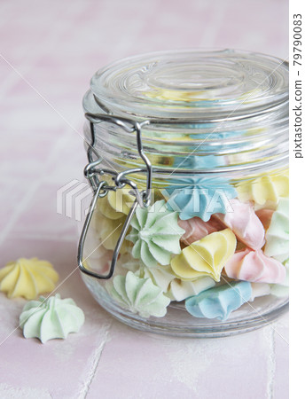 Small colorful meringues in the glass jar Small colorful meringues in the glass jar 79790083