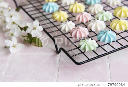 Multicolored meringue on a baking rack Multicolored meringue on a baking rack 79790084