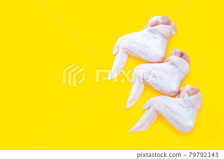 Fresh raw chicken wings on yellow background. 79792143