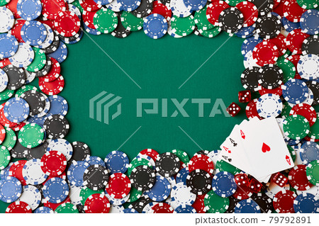 Casino chips, playing cards and dices on green fabric table Casino chips, playing cards and dices on green fabric table 79792891