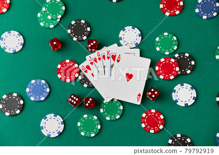 Casino chips, playing cards and dices on green fabric table Casino chips, playing cards and dices on green fabric table 79792919