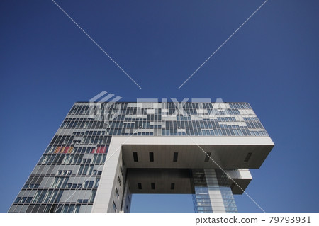 Futuristic crane houses called Kranhaus situated at Rheinau docks in Cologne, Germany Futuristic crane houses called Kranhaus situated at Rheinau docks in Cologne, Germany 79793931