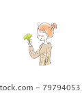 Young woman holding autumn leaves in her hands 1 79794053