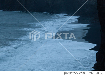 The waves of the atlantic ocean are lapping on the volcanic black beach, Iceland The waves of the atlantic ocean are lapping on the volcanic black beach, Iceland 79795012