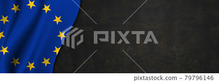 European Union flag on concrete wall. Banner with fabric texture of the flag of European Union European Union flag on concrete wall. Banner with fabric texture of the flag of European Union 79796146