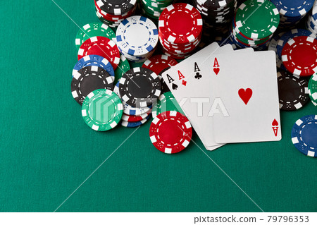 Casino chips, playing cards and dices on green fabric table Casino chips, playing cards and dices on green fabric table 79796353