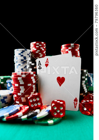 Casino chips, playing cards and dices on green fabric table Casino chips, playing cards and dices on green fabric table 79796360