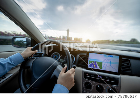 Driving car on city street Driving car on city street 79796617
