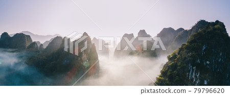 Aerial panorama view of beautiful sunrise over karst mountain peak landscape 79796620