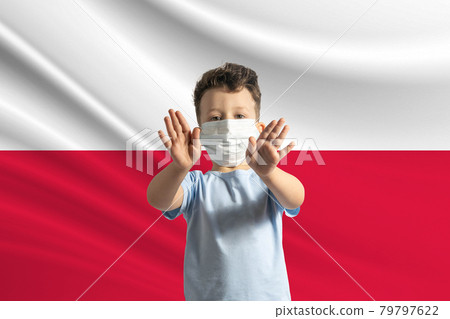 Little white boy in a protective mask on the background of the flag of Poland. Makes a stop sign with his hands, stay at home Poland Little white boy in a protective mask on the background of the flag of Poland. Makes a stop sign with his hands, stay at home Poland 79797622