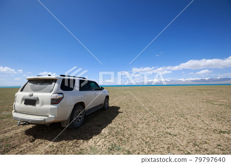 Off road car on the lakeside in Qinghai,China Off road car on the lakeside in Qinghai,China 79797640