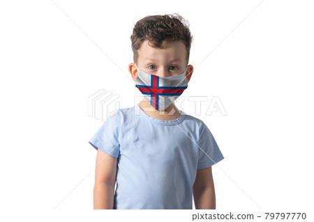 Respirator with flag of Faroe Islands. White boy puts on medical face mask isolated on white background Respirator with flag of Faroe Islands. White boy puts on medical face mask isolated on white background 79797770