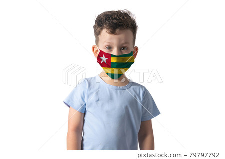 Respirator with flag of Togo. White boy puts on medical face mask isolated on white background Respirator with flag of Togo. White boy puts on medical face mask isolated on white background 79797792